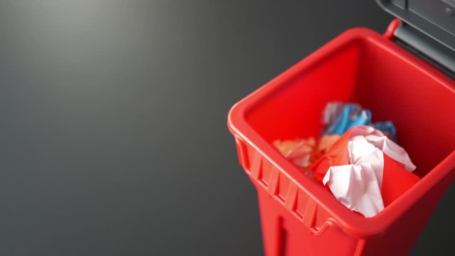colorful paper trash throw into plastic bin, creativity concept