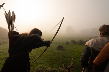 vikings dressed in historic costumes with longbows