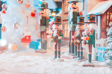 army christmas dall and house with snow in the big glass ball and light.