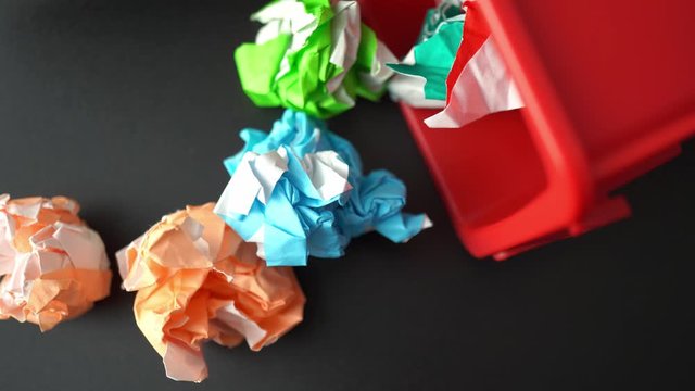 colorful paper trash throw into plastic bin, creativity concept