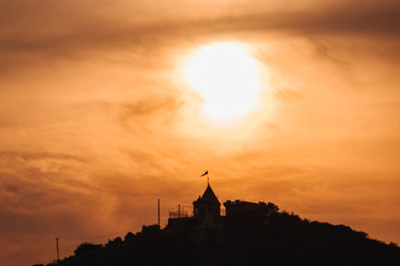 Fototapeta na wymiar Sunset at the temple above the hills in Wankaner, Gujarat, India