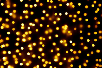 Fototapeta na wymiar Abstract blur golden bokeh light Christmas holiday background
