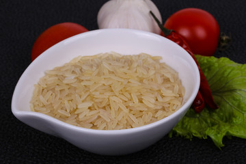 Raw uncooked rice in the bowl