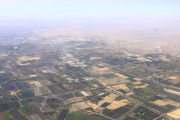 Panoramic view of green fields near the desert in Uzbekistan