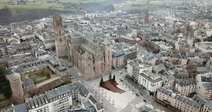 Aerial view of French city of Rodez with tower of Cathedral and spire of church of Saint Amans in autumn day