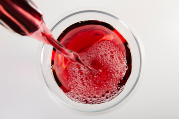 Glass of red wine with shadow.Top view. Abstract red wine bubbles.