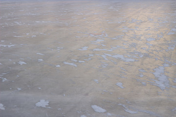 ice background with marks from skating and hockey, blue texture
