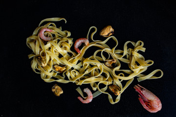 pasta tagliatelle seafood (shrimp, mussels) menu concept. food background. top view. copy space