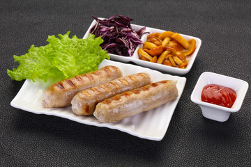 Grilled sausages served mushrooms and cabbage