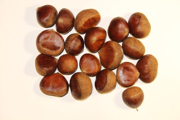 Fresh chestnuts isplated close up on white background