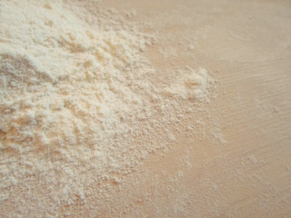 white flour on wooden table, top view ,free space