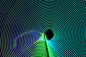 Obraz premium Abstract led or neon background. Green curved led lights