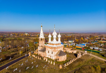 Fototapeta na wymiar Church of the Holy Virgin in the village of Dunilovo in autumn, Ivanovo region, Russia. Shooting from the air