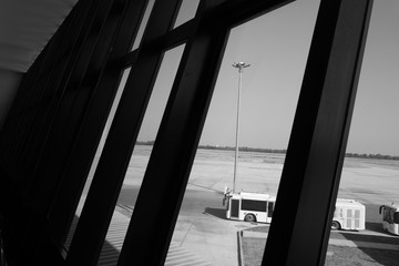 Fototapeta na wymiar Shuttle airport bus in the airport terminal , black and white
