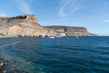 Panoramic view of Puerto de Mogan coastline. Yachts in a background. Gran Canaria. Canary Islands, Spain