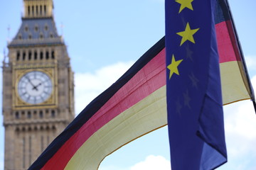 Fototapeta na wymiar The EU and German flags at Westminster with Big ben in the background.