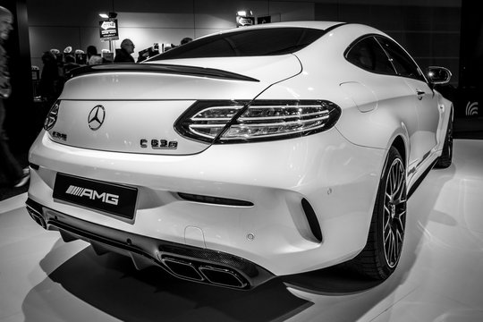 STUTTGART, GERMANY - MARCH 03, 2017: Compact luxury car Mercedes-AMG C63 S Coupe, 2016. Rear view. Black and white. Europe's greatest classic car exhibition "RETRO CLASSICS"