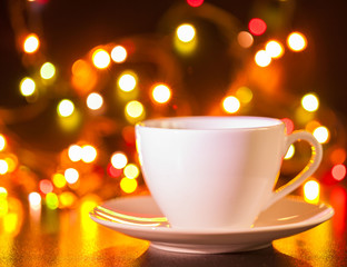 Fototapeta premium Food, white cup of tea and saucer, lighting lights