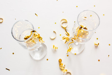 champagne glasses with confetti on a white background christmas concept
