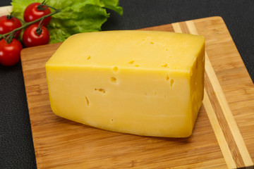 Hard yellow tasty cheese brick