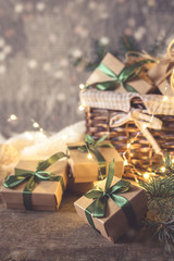 Christmas and zero waste, eco friendly packaging gifts in kraft paper on a wooden table, eco christmas holiday concept, eco decor banner.