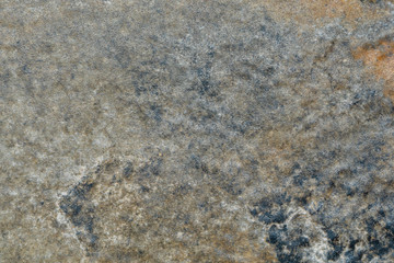 Old dark rusty stone wall.