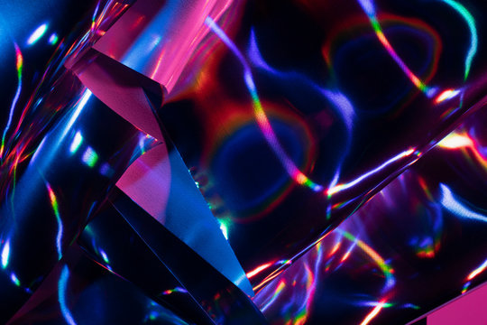Reflection of light on holographic foils with neon lighting