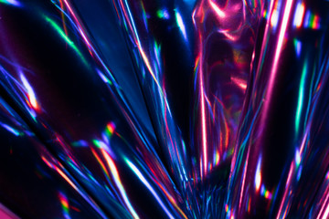 Reflection of light on holographic foils with neon lighting