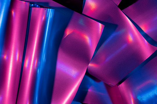 Reflection of light on holographic foils with neon lighting