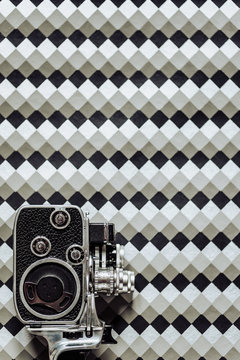 8mm camera on geometric background