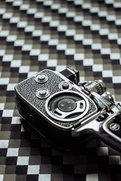 8mm camera on geometric background