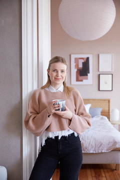 A lady having a hot beverage.
