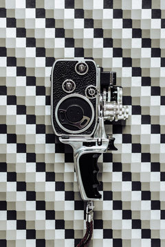 8mm camera on geometric background