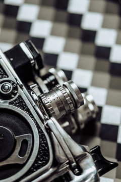 8mm camera on geometric background