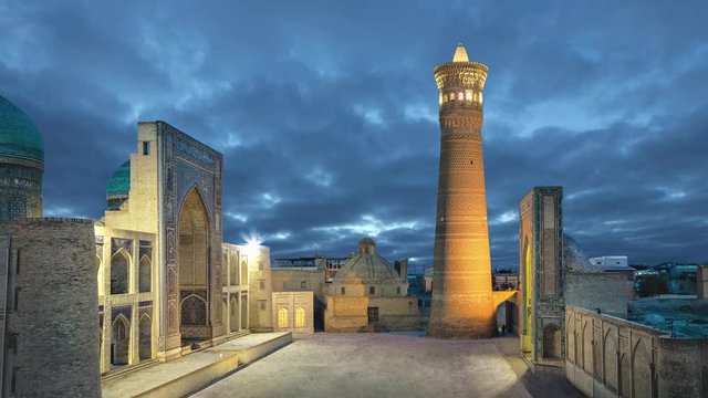 Poi Kalan at dusk - an Islamic religious complex located around the Kalan minaret in Bukhara, Uzbekistan (static image with animated sky)