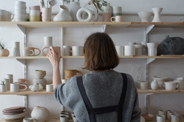 Ceramist in her pottery shop