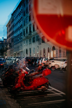 Late evening in the streets of Rome - scooter parking doubled image