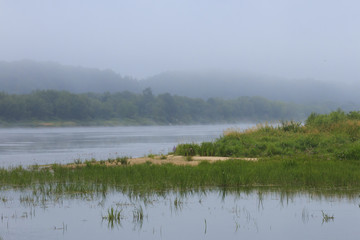 Obraz na płótnie Canvas The summer morning landscape at the river.