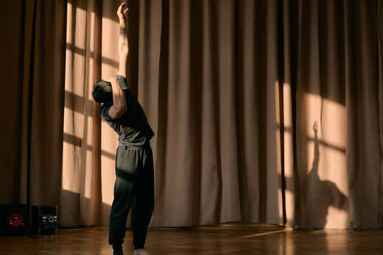 Expressive young dancer training in sunny studio