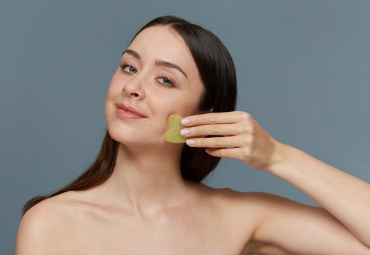 Gua Sha stone facial massage