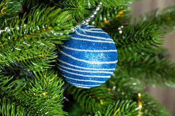 Christmas holiday decorations and toys on home Christmas tree.