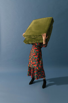 model with floral pattern dress on blue background