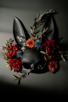 easter rabbit surrounded by flowers and wild leaves