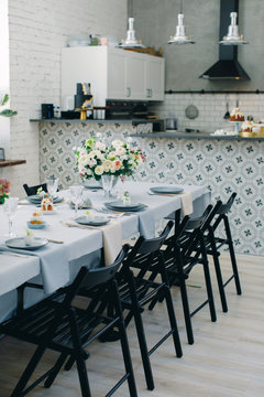 Kitchen and beautiful table set in room. Beautiful table setting for Easter