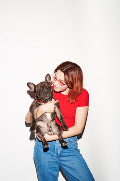 Portrait of black bulldog and its owner
