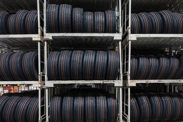 New tires stacked at a warehouse