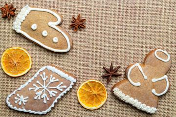 Gingerbread man. Xmas homemade Ginger, Honey cookies on linen background. Merry Christmas greeting card, banner. Winter holiday xmas theme. Happy New Year. Space for text