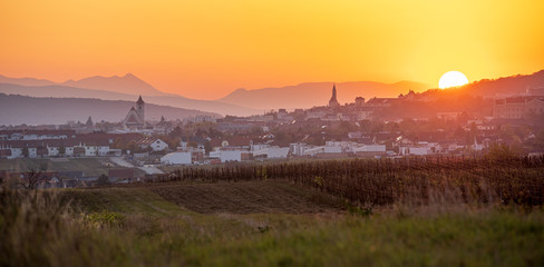 Panaoramic sunset view of Eisenstadt, Burgenland in Austria during golden hour - obrazy, fototapety, plakaty