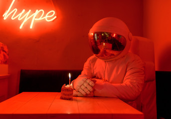 Unrecognizable astronaut celebrating birthday