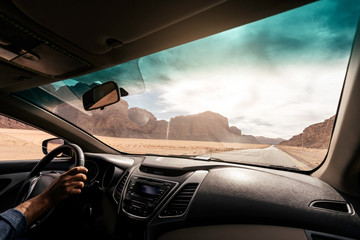 Inside Of Car Driving On Road Between Hills